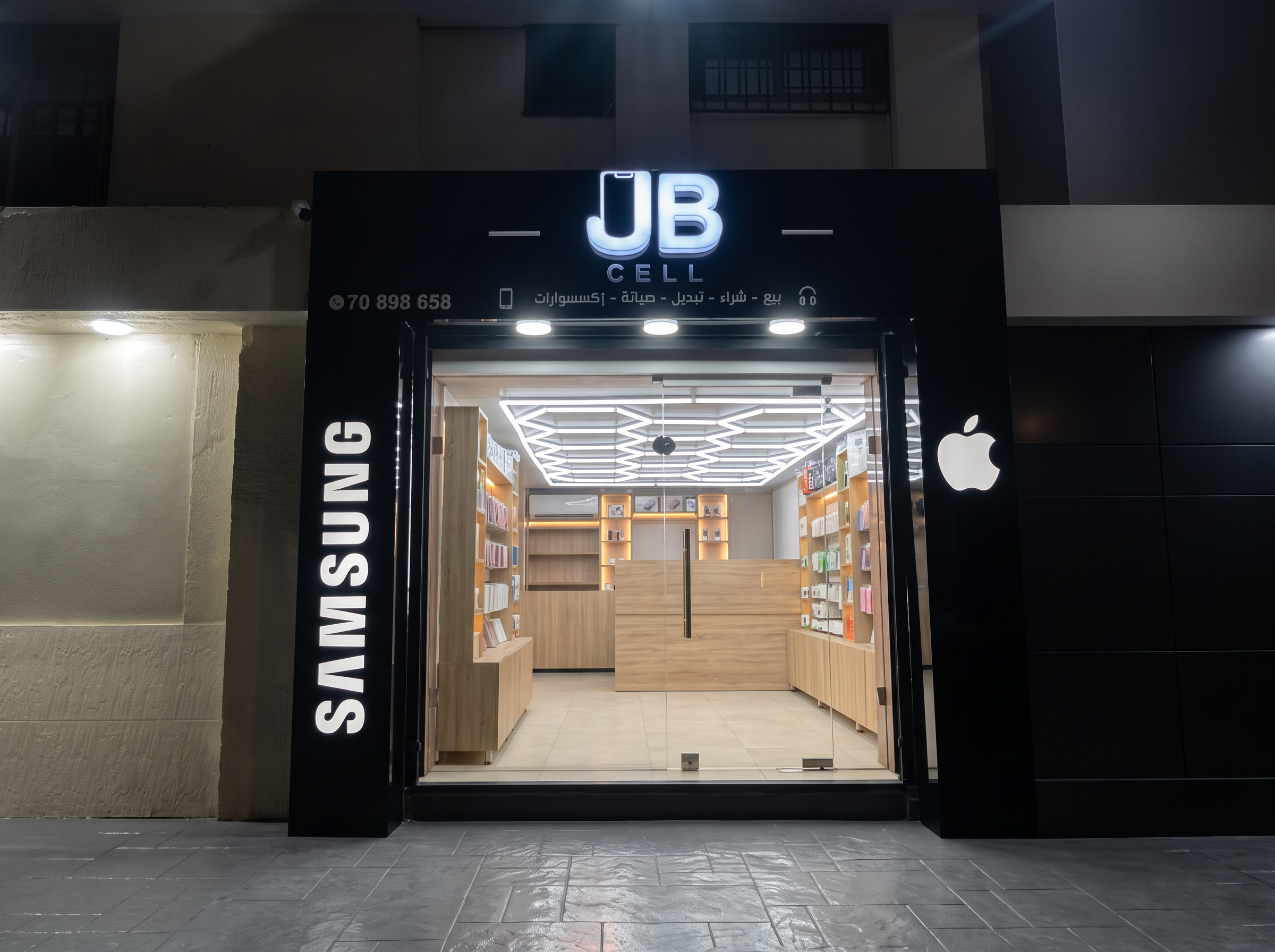 JB Cell storefront lit up at street level